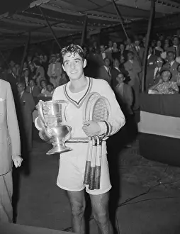 Richard Gonzales Holding Tennis Trophy