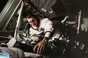 Adjusting Prints: Richard Gordon Working on Command Module