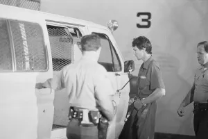Suspect Prints: Richard Ramirez Entering Police Van