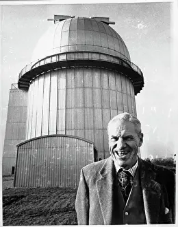Sussex Prints: Richard Woolley Stands in Front of Large Telescope