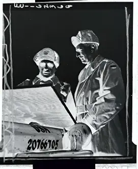 Ridgway and Clark Looking at Map