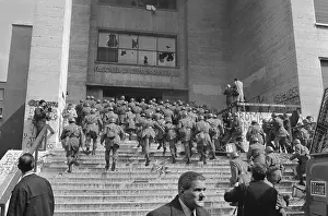 Riot Police Entering a University Building