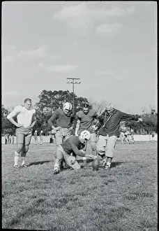 Augustine Prints: Rip Engle Demonstrating Football Kicking