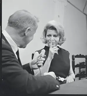 Rita Hayworth Holding Finger to Lips