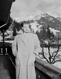 Gstaad Prints: Rita Hayworth Posing in Overcoat