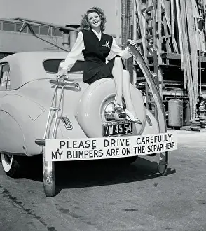 Rita Hayworth Posing on Vehicle