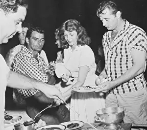 Rita Hayworth and Robert Mitchum Enjoying Barbecue Food