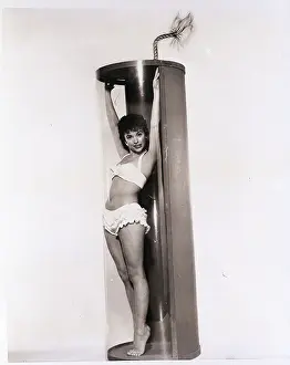 Firecracker Prints: Rita Moreno Posing in a Firecracker Prop