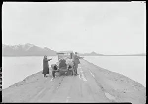 Flood Prints: Road Between Flooded Dry Lake