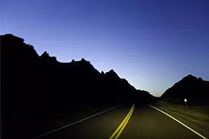 Road through sandstone buttes, night (blurred motion)