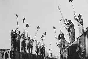 Prints of (Original Caption). Mussolini Receives New Salute Benito Mussolini (1883-1945) Prints: Road Workers with Shovels for Salute