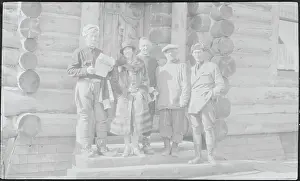 Roald Amundsen and Associates Posing in Front of Log Cabin