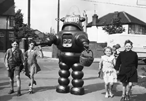 Futuristic Prints: Robby the Robot Walks with Children