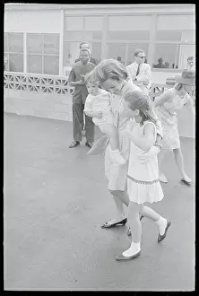 Robert and Ethel Kennedy Carrying Their Children