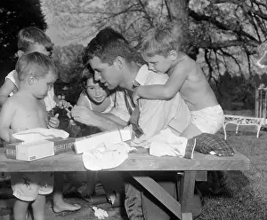 Robert F. Kennedy with His Children and a Playmate Outdoors