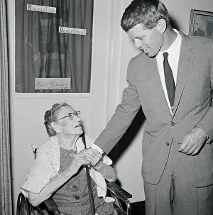 Robert F. Kennedy Holding Hand of Elderly Woman