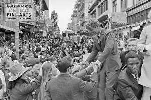 Robert F. Kennedy Shaking Hands in Crowd