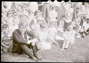 Robert F. Kennedy Sitting on Lawn With Wife and Corps Children