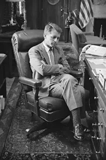 Robert F. Kennedy Sitting With His Leg Crossed at His Desk