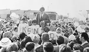 Robert F. Kennedy Standing With Flock of Supportive Children