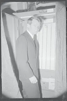 Robert F. Kennedy Standing in Voting Booth