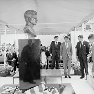 Robert F. Kennedy Walking Towards Bust of His Late Brother