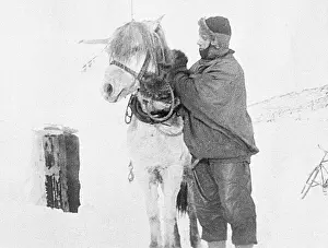 Robert Falcon Scott Preparing for Expedition with Animal