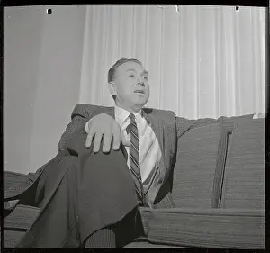 Robert Hofstadter Sitting with One Arm on Back of Couch