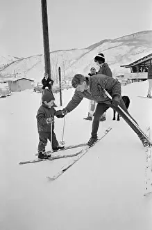 Robert Kennedy Helping John Kennedy Jr. With His Skis