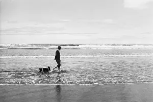 Robert Kennedy Walking on Beach with Dog