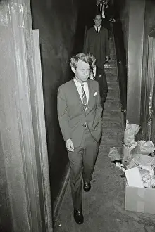 Robert Kennedy Walking Through Garbage Filled Hallway
