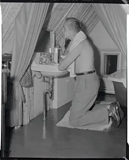 Robert Loomis Shaving in His Miniature Cottage
