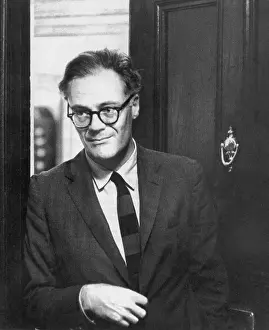 Robert Lowell Standing in Doorway