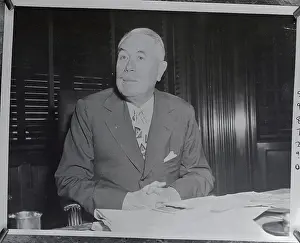 Robert R Prints: Robert McCormick Sitting at Desk