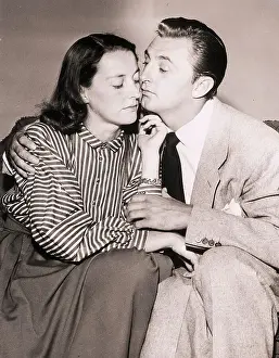 Comforting Prints: Robert Mitchum and Wife Hugging