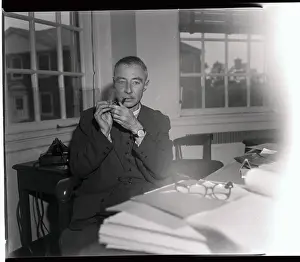 Robert Oppenheimer Lighting a Pipe