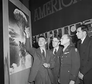 Robert Oppenheimer Pointing to Picture of Hiroshima Blast