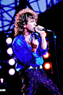 Iconic Concert Prints: Celebrate the Unforgettable Music Event That United the World: Robert Plant On Stage At Live Aid