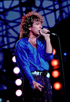 Iconic Concert Prints: Celebrate the Unforgettable Music Event That United the World: Robert Plant On Stage At Live Aid