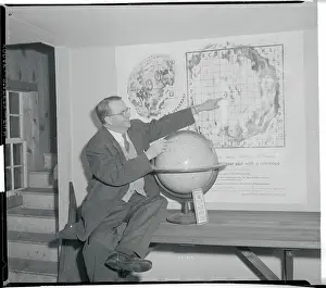Glen Cove Prints: Robert R. Coles Pointing to Moon Map
