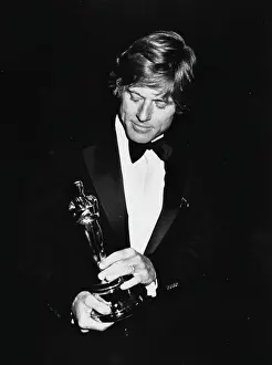 Prints of Actor Robert Redford holding his Best Actor Oscar for the film Ordinary People at the 53rd Academy Awards, Los Angeles, March 31st 1981. (Photo by Fotos International/Archive Photos/Getty Images) Robert Redford: Classic Hollywood Elegance: Robert Redford