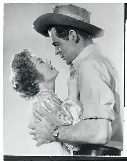 Passion Prints: Robert Ryan Embracing Barbara Stanwyck