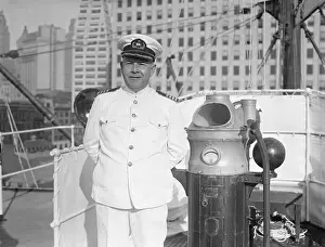 Robert Wilmott Standing With Arms Behind His Back