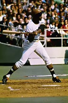 Roberto Clemente Swinging with Baseball Bat