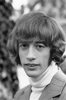 Prints of LOS ANGELES - JANUARY 26: Robin Gibb of the pop group The Bee Gees poses for a portrait on January 26, 1968 in Los Angeles, California. (Photo by Michael Ochs Archives/Getty Images) A Visual Journey Through the Legendary Brothers’ Timeless Legacy: Robin Gibb