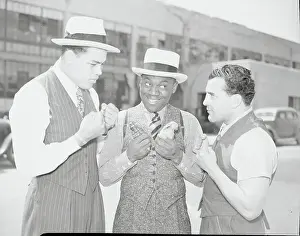Bill Robinson with Joe Louis and Fidel La Barba