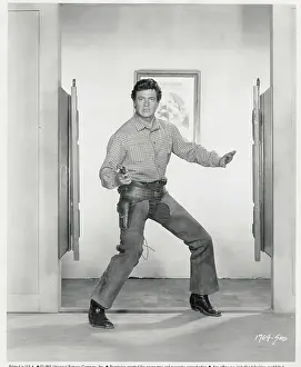 Rock Hudson Holding a Gun