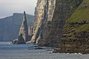 Images Dated 11th June 2013: Rock pinnacle and cliff, west coast of Sandoy, Faroe Islands, Denmark