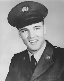 Rock and roll musician Elvis Presley Enlists in the Army