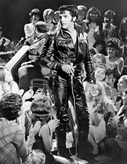 Rock and roll musician Elvis Presley performing